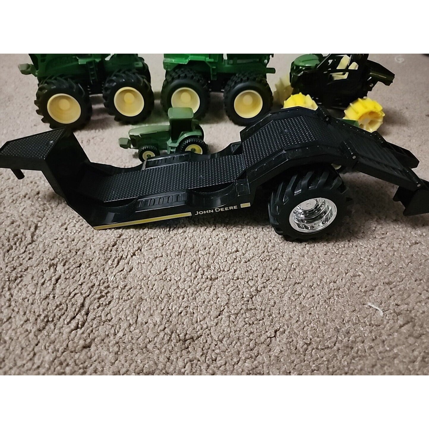 Lot of John Deere seven Monster Tire Vehicles