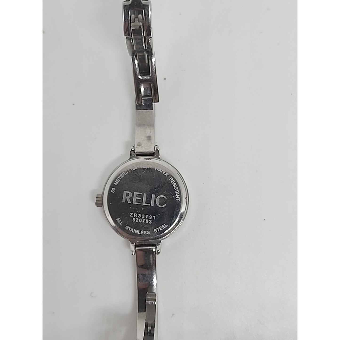 RELIC WOMEN'S DRESS WATCH WITH GEMS AROUND BLUE FACE & ON BRACELET WORKS!