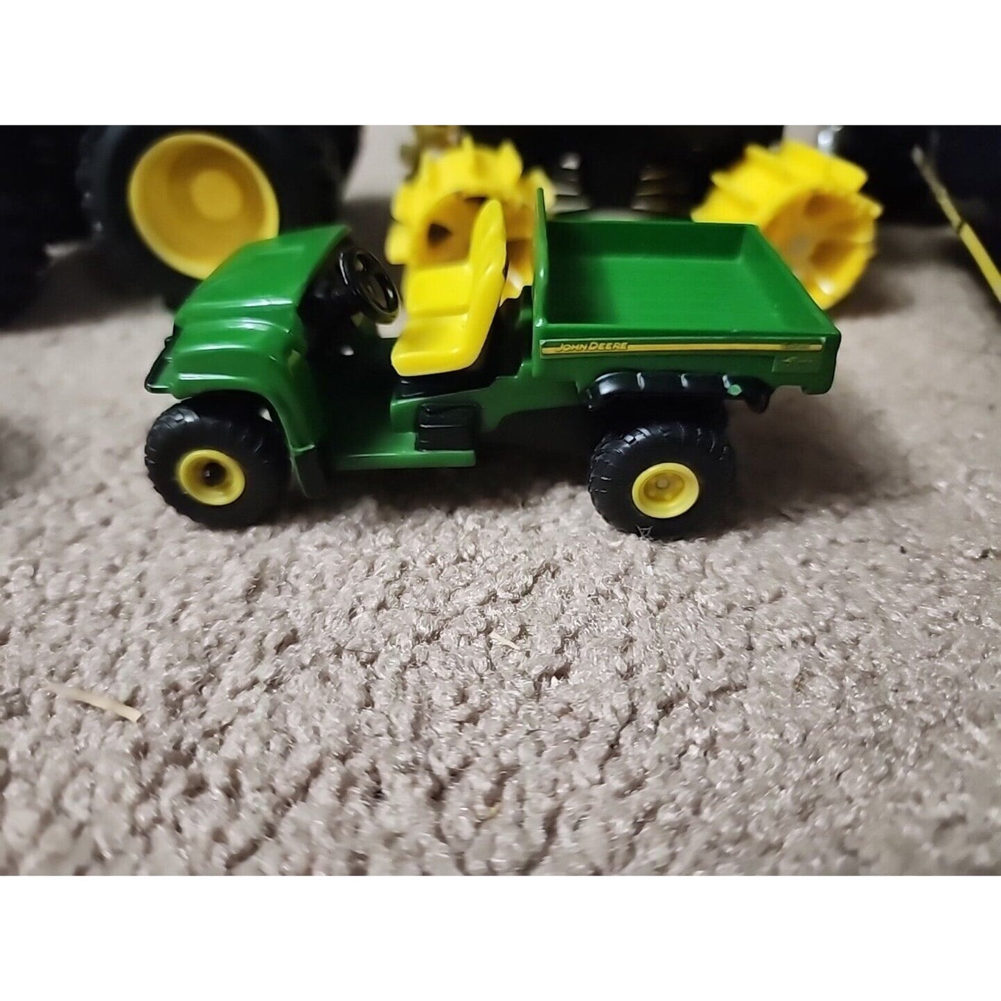 Lot of John Deere seven Monster Tire Vehicles