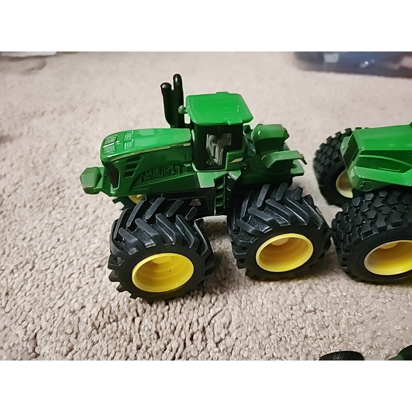 Lot of John Deere seven Monster Tire Vehicles