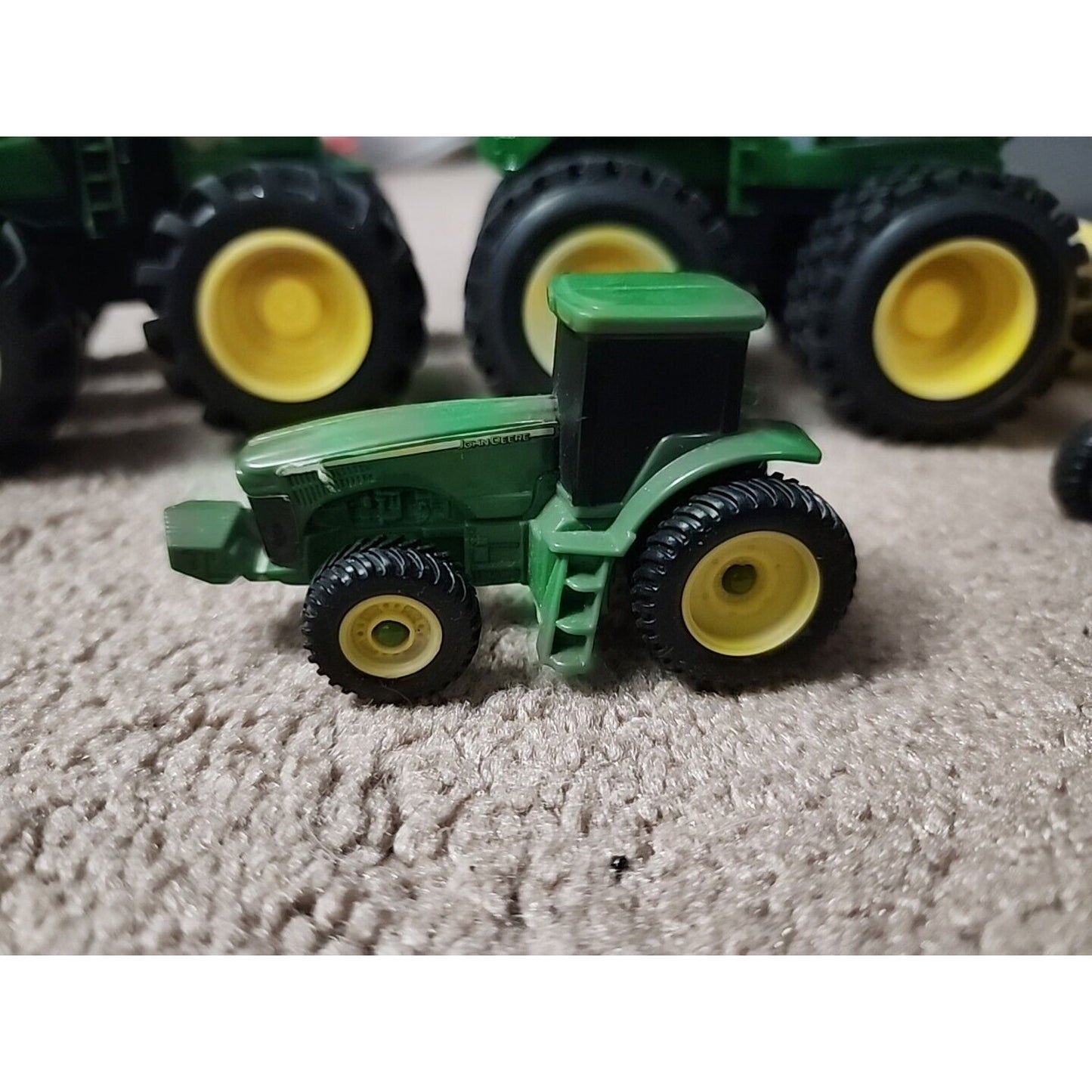 Lot of John Deere seven Monster Tire Vehicles